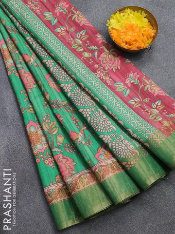Semi matka saree teal green with allover floral prints and zari woven border