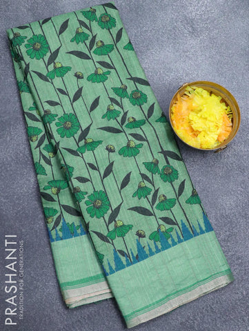 Semi matka silk saree green with allover floral prints and small zari woven border