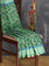 Semi matka silk saree green with allover floral prints and small zari woven border