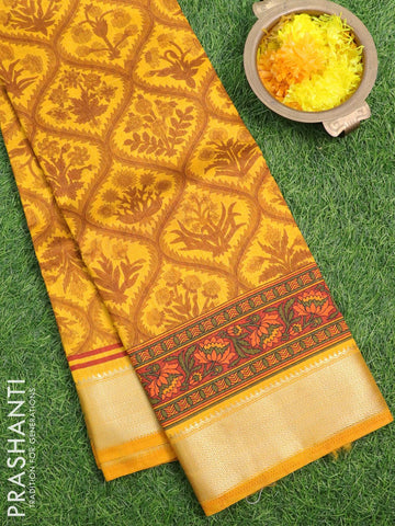 Semi raw silk saree yellow and rust shade with allover prints and zari woven border